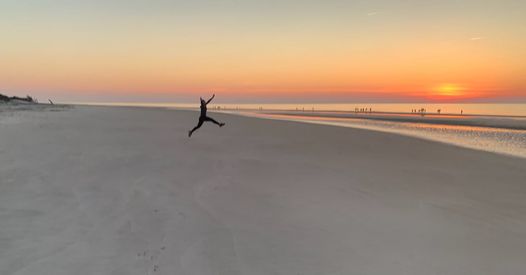 Cassie jumping at the beach